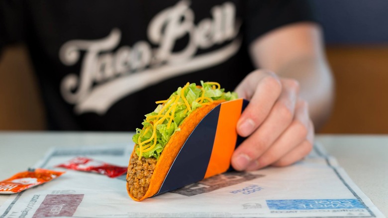 Person with Doritos Locos Taco