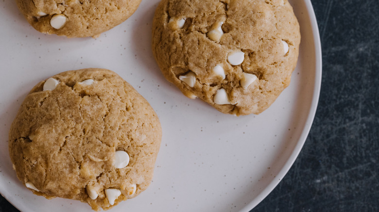 Sourdough discard cookies with white chocolate chips on plate.