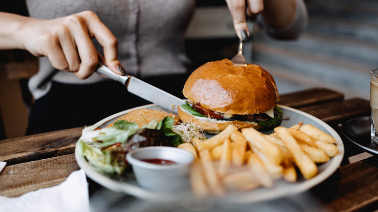Cutting burger in half