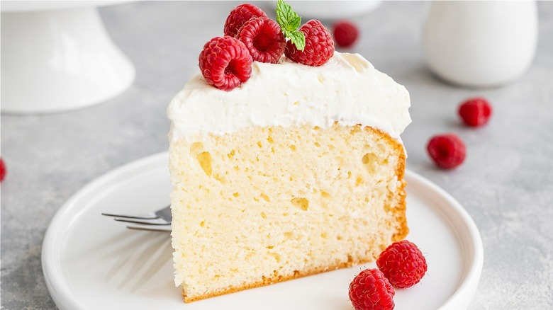 cake with icing and raspberries
