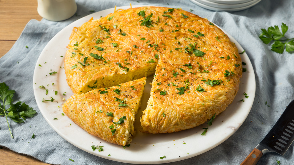 Tortilla española served on a white dish