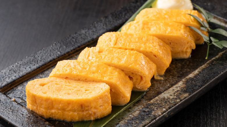 Sliced tamagoyaki on a plate