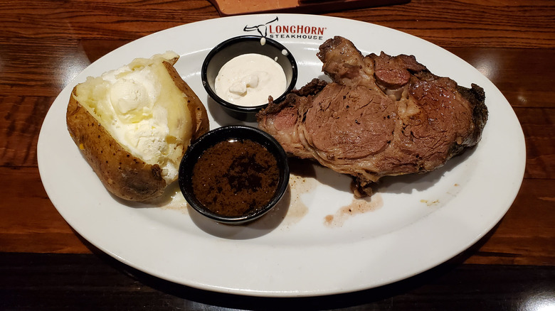 A LongHorn Steakhouse steak and baked potato