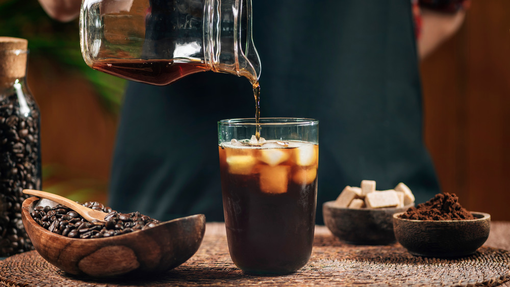 Pouring cold brew over ice