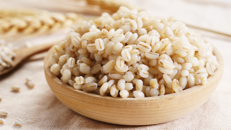 Wooden bowl of cooked barley