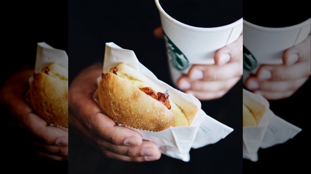 Starbucks Bacon, Gouda, and Egg Sandwich with coffee