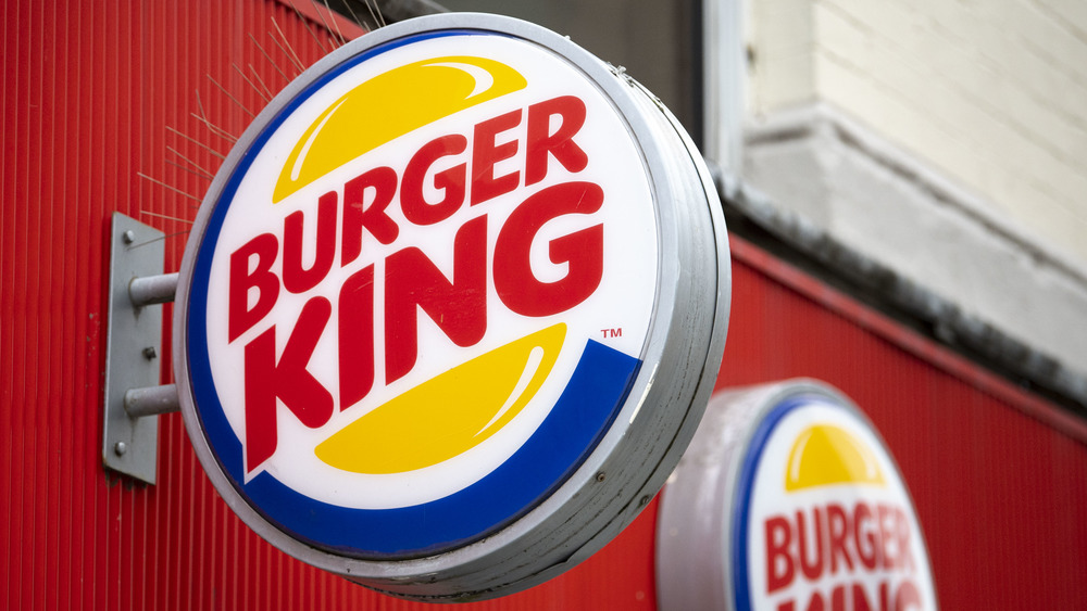 Burger King sign against red wall