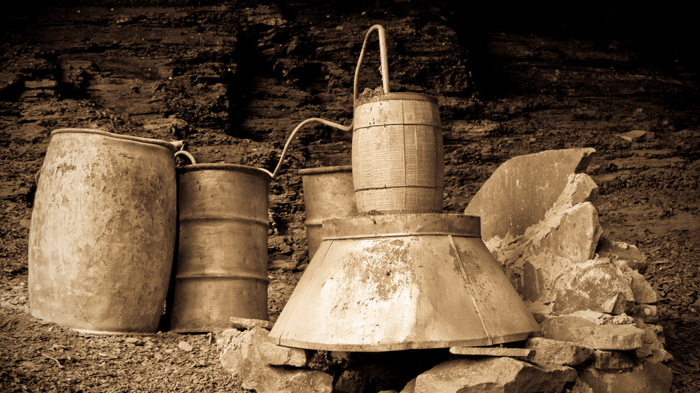 Old-fashioned moonshine in barrels