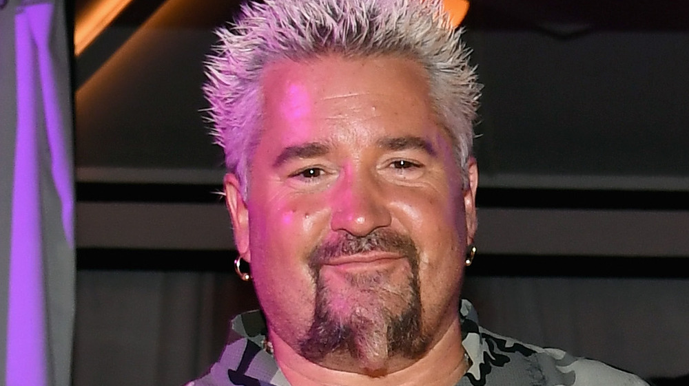 Closeup of Guy Fieri in a camouflage shirt