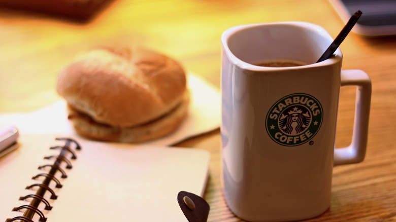 Mug with Starbucks logo on table