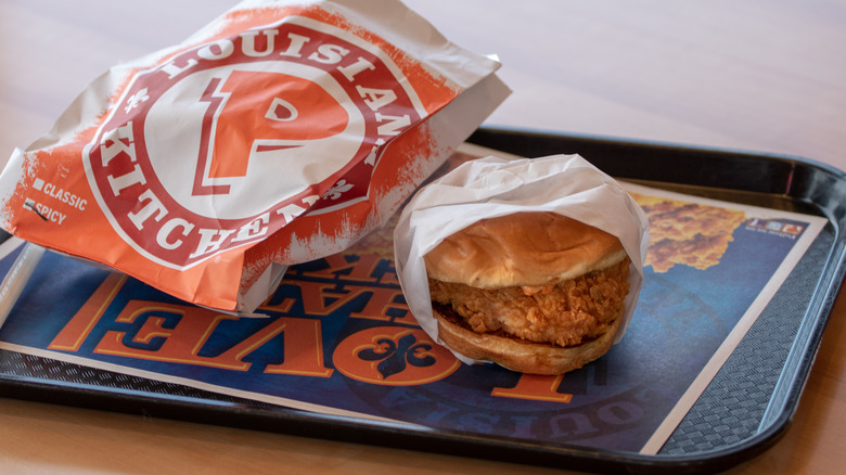 Popeyes fried chicken sandwich on tray