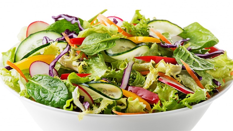 bowl of salad with cucumbers and radishes