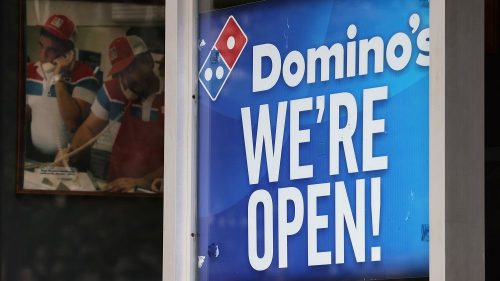 Domino's sign reading "we're open"