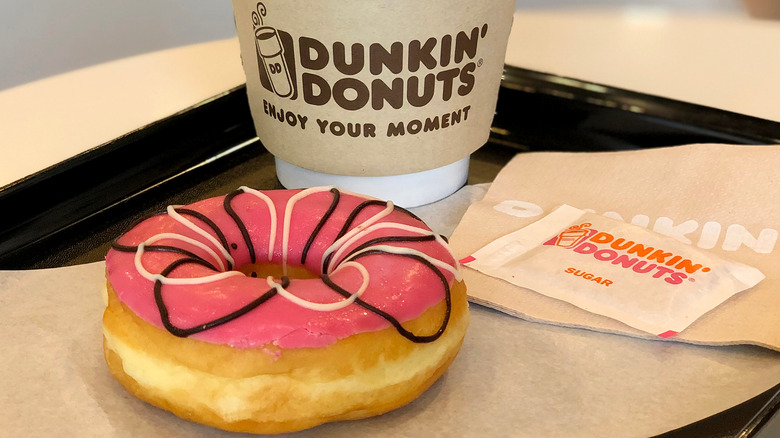 Dunkin' coffee and pink iced donut