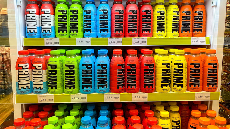 Many PRIME hydration and energy drinks displayed inside a store