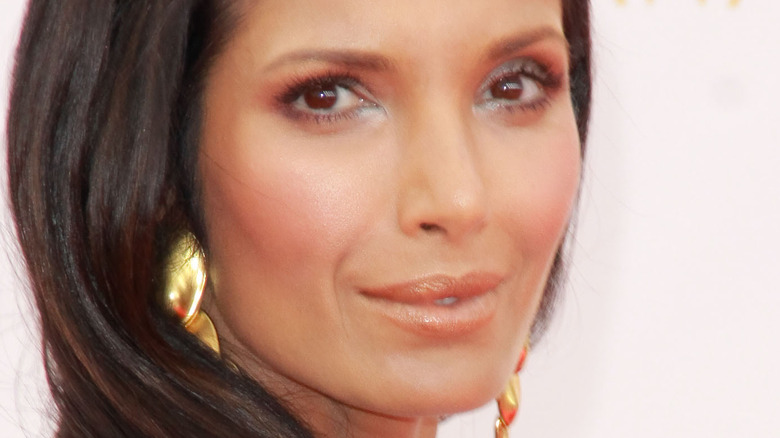 Padma Lakshmi smiling on the red carpet