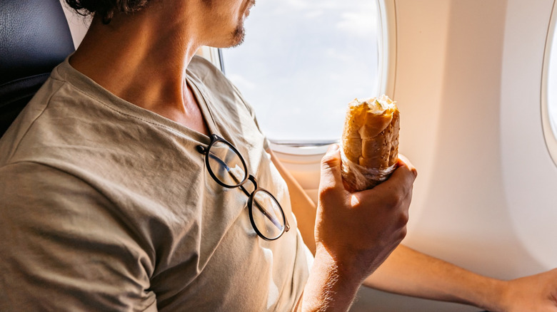 Eating sandwich on airplane