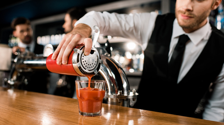Bartender making bloody mary