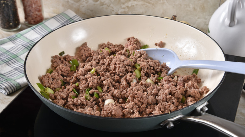 Browned ground beef in pan