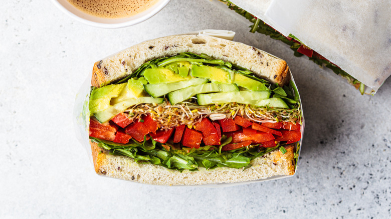 veggie sandwich on marble surface