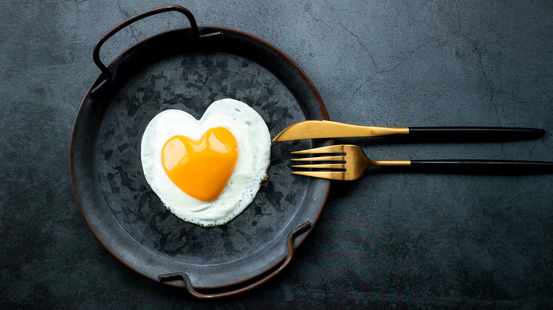 Egg in black frying pan