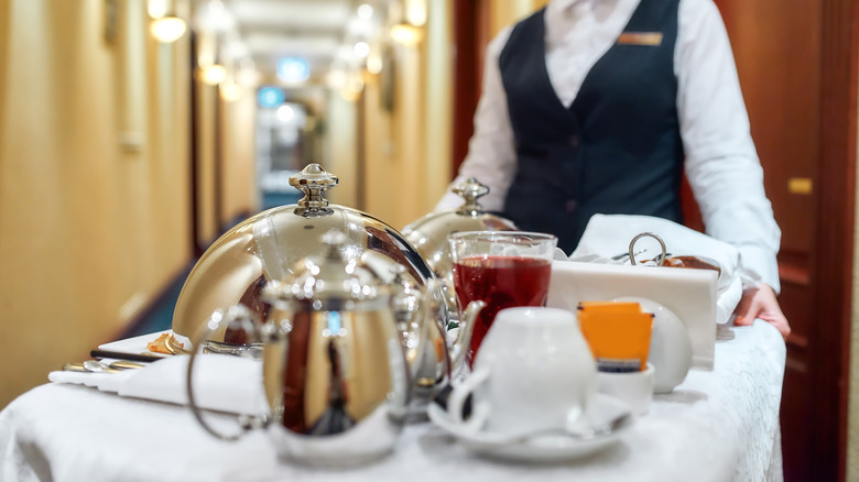Hotel staff delivers room service