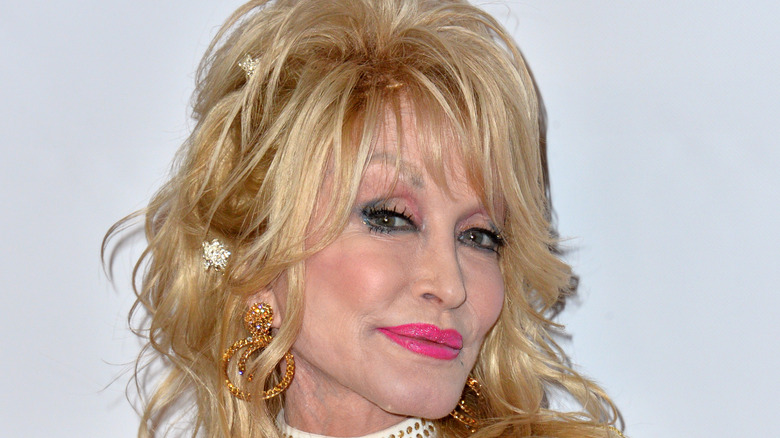 closeup of Dolly Parton with pink lipstick