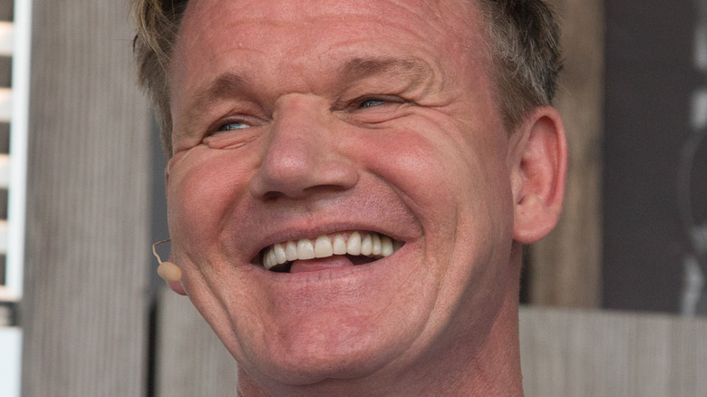 Close up, Gordon Ramsay (wearing a blue striped shirt)