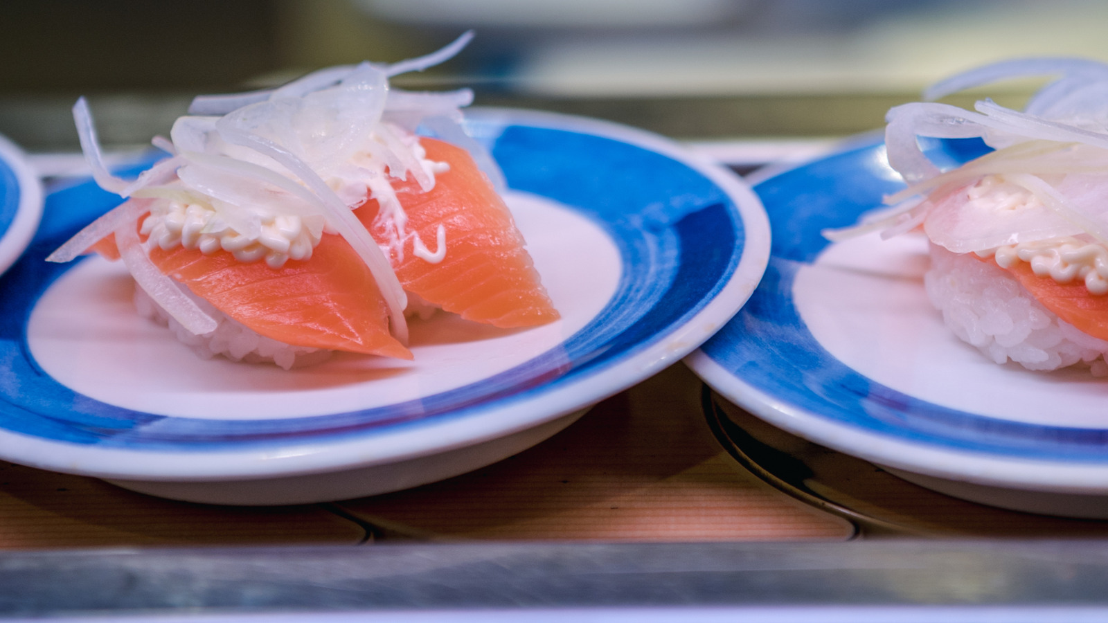 The Etiquette Mistake You May Be Making At Newer Conveyor Belt Sushi Restaurants
