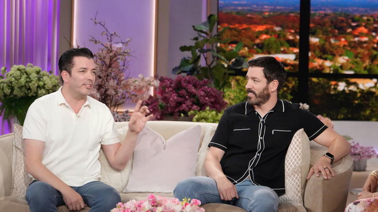 Property Brothers Drew and Jonathan Scott being interviewed on a TV show