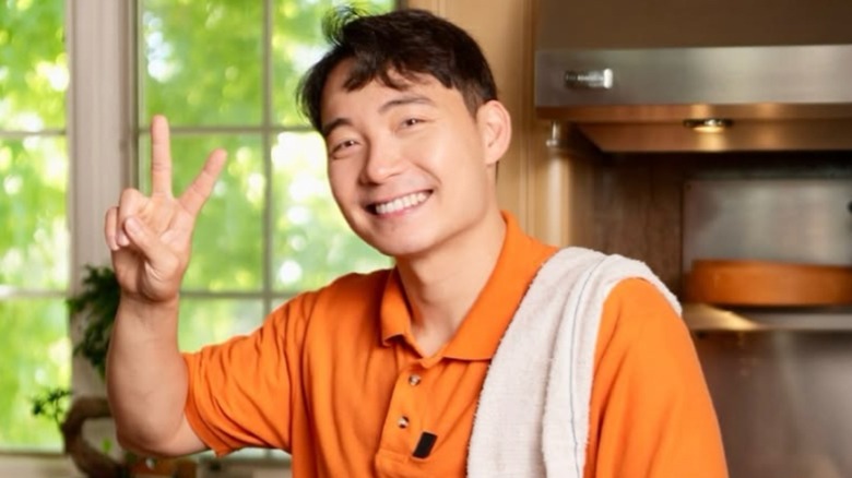 Nigel Ng (aka Uncle Roger) in kitchen