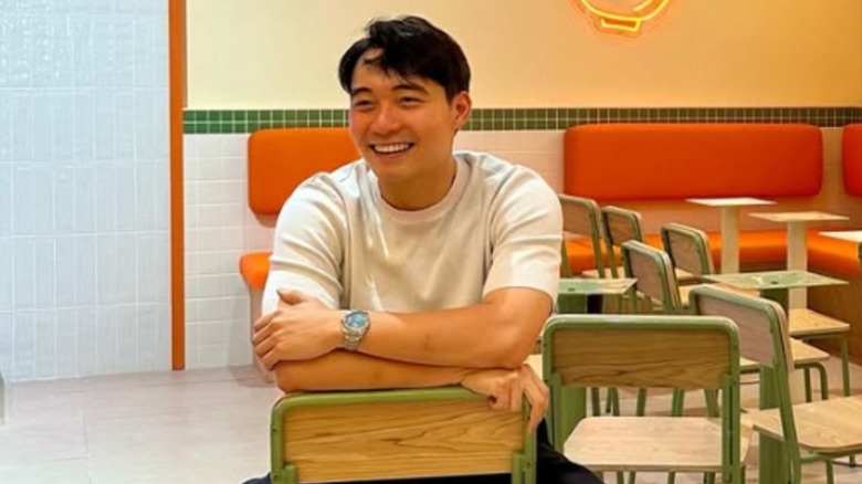 Nigel Ng smiling in his restaurant