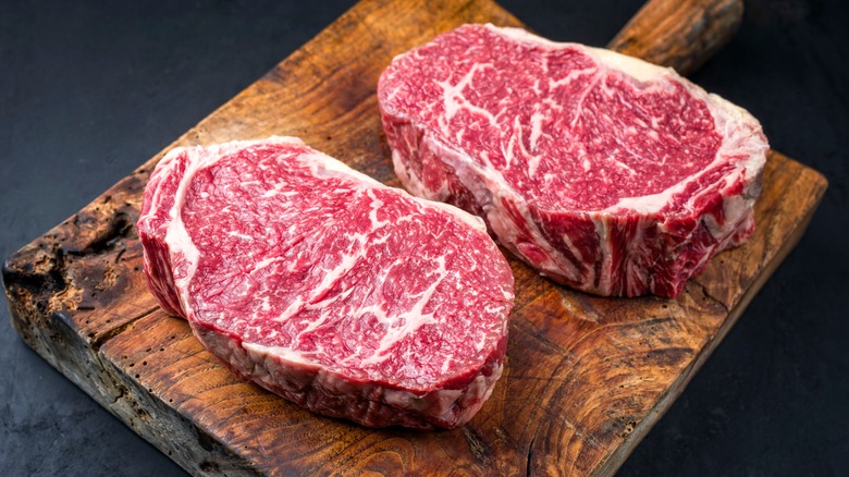 Wagyu beef steaks on board
