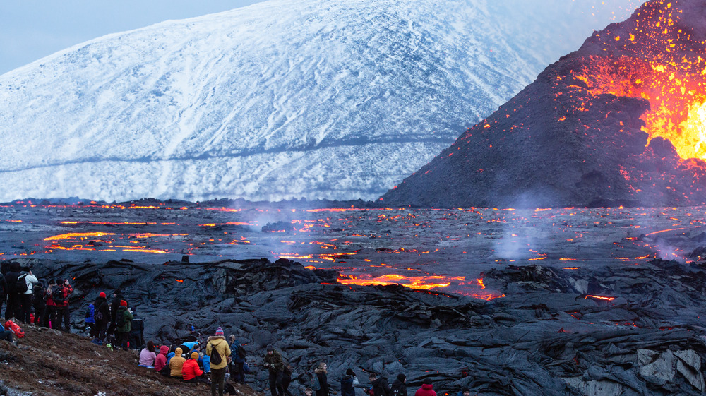 People gather to watch volcanic eruption in Iceland