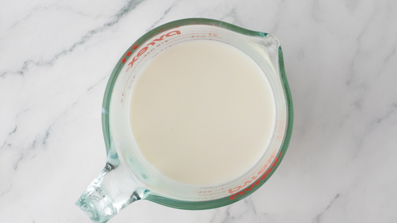 Milk in measuring cup