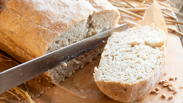 Crusty bread being sliced