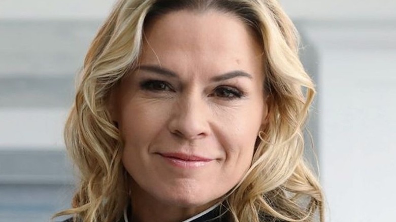 Cat Cora with a black chef's jacket