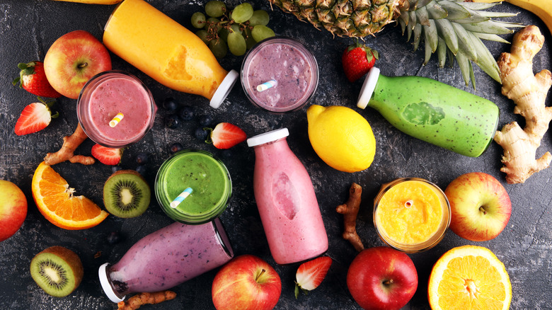 bottles of smoothies among various ingredients