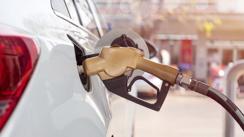 Gasoline pump going into a car