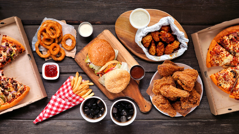 a bunch of fast food items on a wooden table