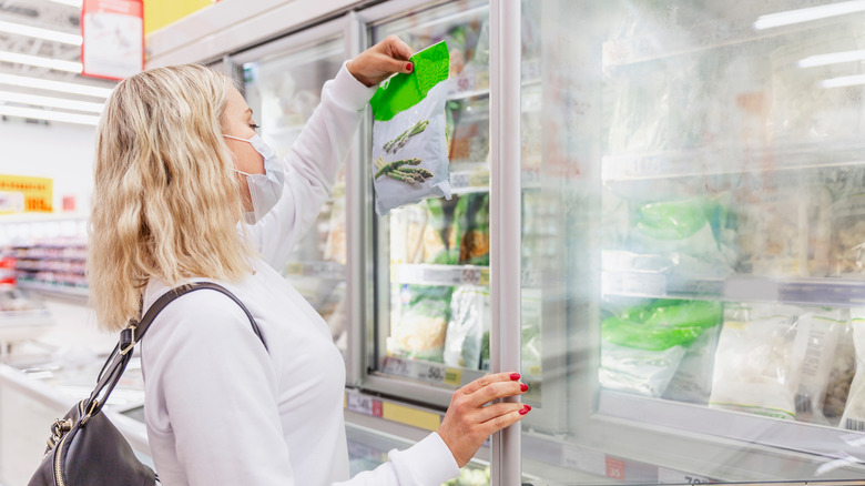 Woman in a freezer aisle