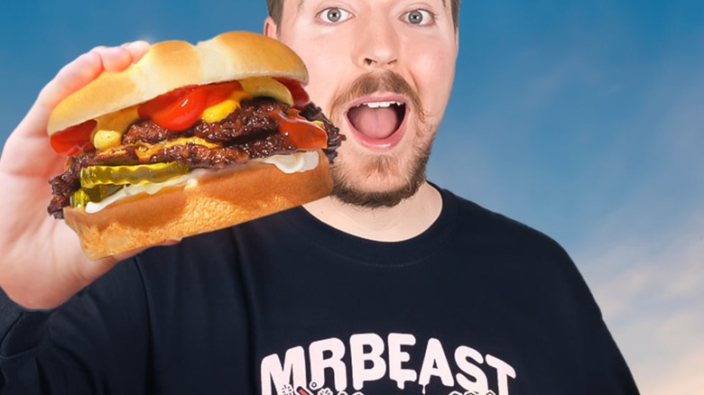 MrBeast holding a burger from MrBeast Burger