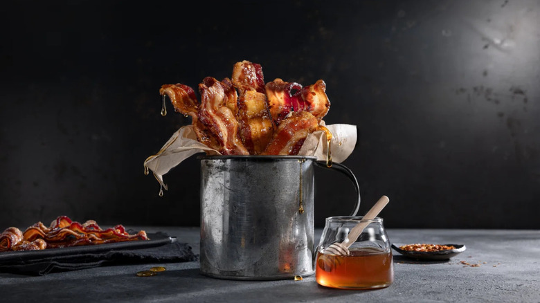 A bucket of candied bacon, dripping with honey