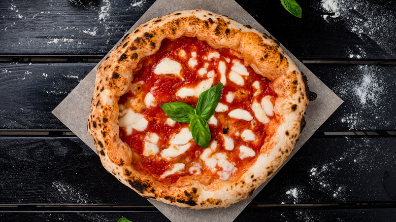 A margherita pizza on table