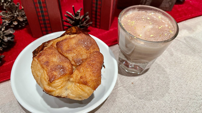 Starbucks Cinnamon pull-apart bread on white plate and caramel miso hot chocolate in glass on table