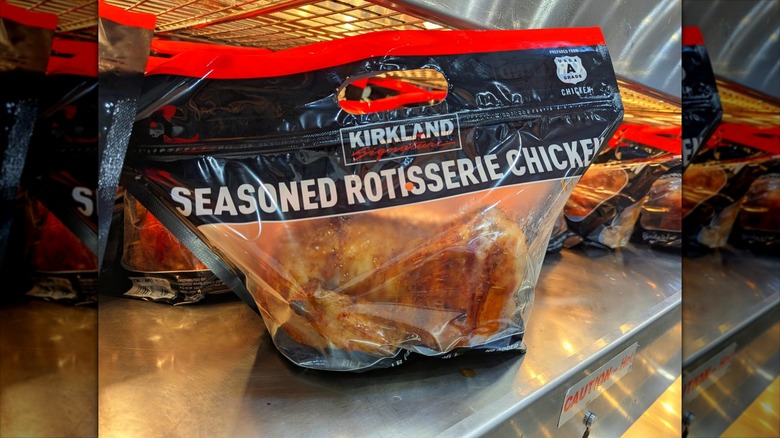 costco rotisserie chicken in bag on shelf inside store