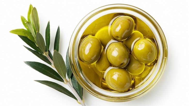 Olives in jar of olive oil