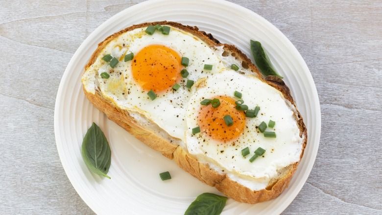fried eggs and scallions on bread