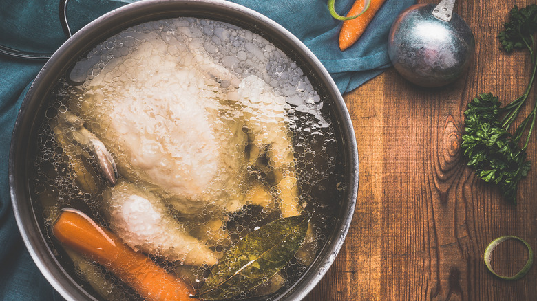 boiling chicken in pot