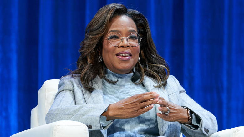 Oprah Winfrey in glasses smiling